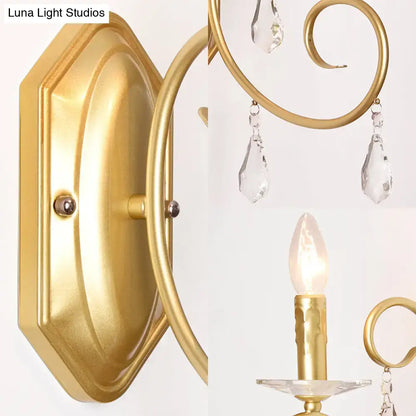 Gold-finished wall lamp with elegant curved arms and clear crystal teardrop pendants for 110v to 240v use