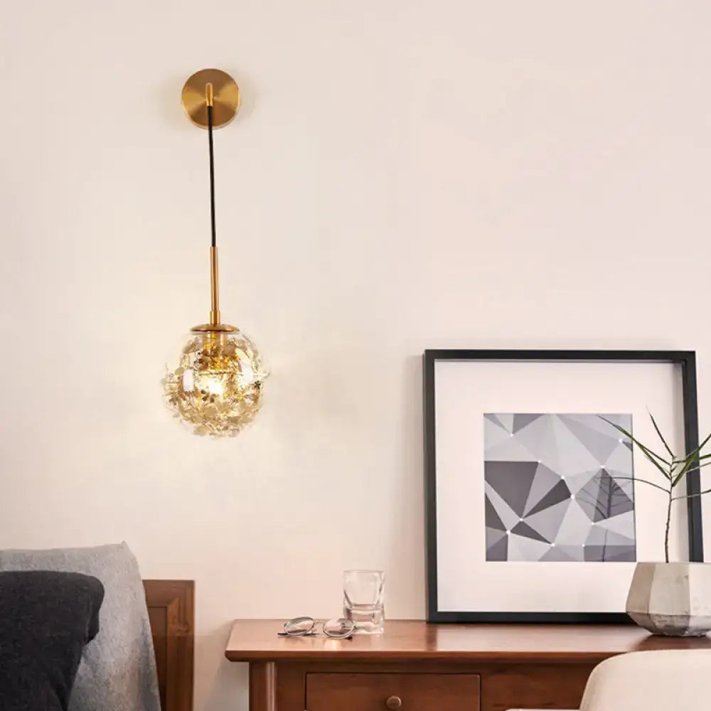 Modern gold wall light with clear glass faceted crystal globe shade and black cord for flower deco cloth decor