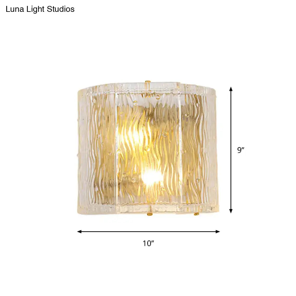Modern gold clear ripple glass wall sconce with textured translucent shade and gold-toned metal accents for bedroom wall light