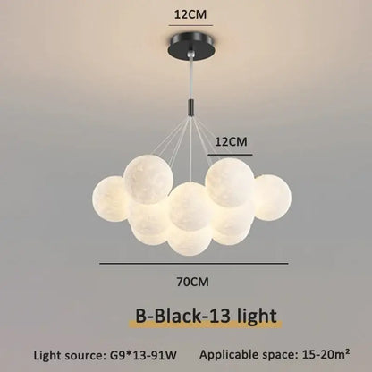 Modern gold cloud bubble ball led pendant lights feature frosted white bulbs and a black ceiling mount for dining room decor