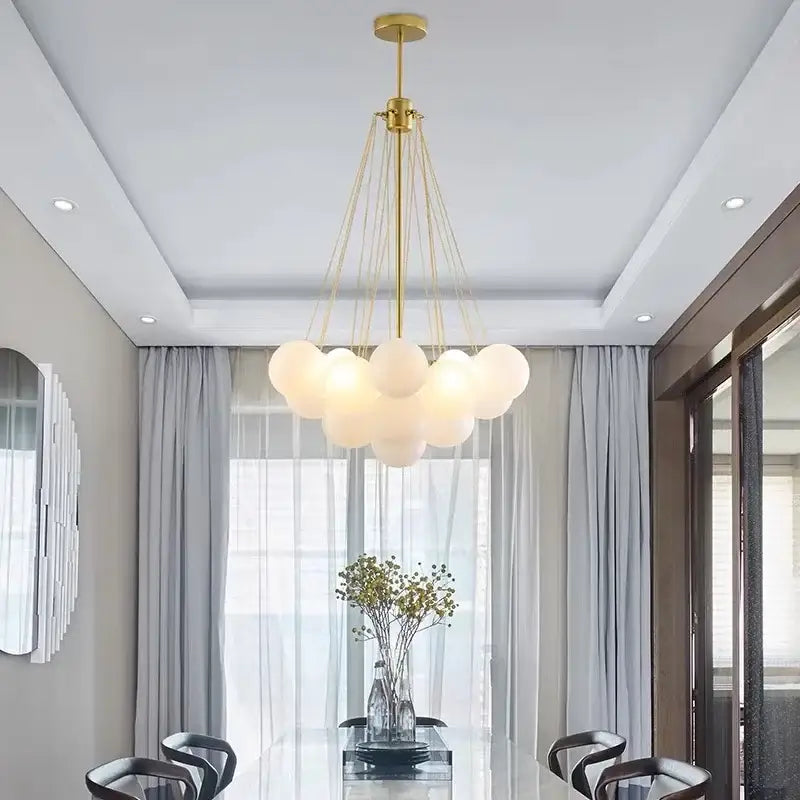 Modern gold cloud glass ball led chandelier with frosted glass globe shades suspended by thin cords for dining room decorbites glass ball