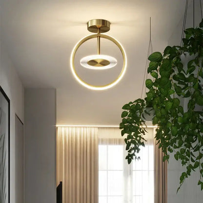 Modern gold-toned concentric led ceiling light with glowing ring and illuminated disc for living room decorbites led ceiling