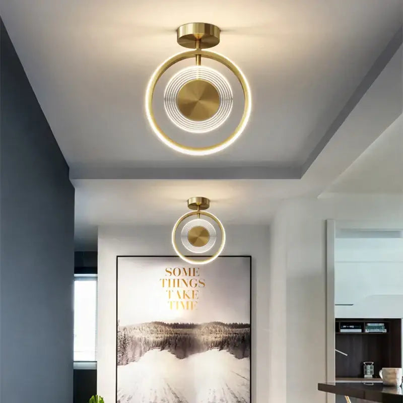 Modern gold-toned circular led ceiling light with concentric rings and central disc for decorbites led ceiling decor