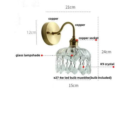Modern gold conch shell wall light fixture with brass-finished copper, faceted glass lampshade, and k9 crystal droplets