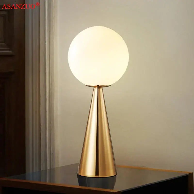 Modern gold cone glass table lamp with frosted spherical globe and conical base ideal for bedroom decorbites cone glass