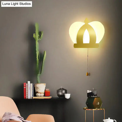 Modern gold crown wall lamp featuring warm glowing light and pull chain for elegant wall lighting in bedroom