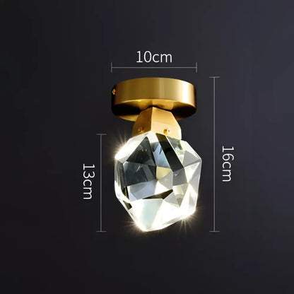Modern gold crystal aisle ceiling light featuring a faceted glass globe and polished gold-toned mounting base decorbites crystal aisle