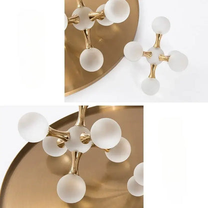 Modern gold-toned chandelier with frosted white glass globes featuring ball molecule geometric decorbites crystal ball design