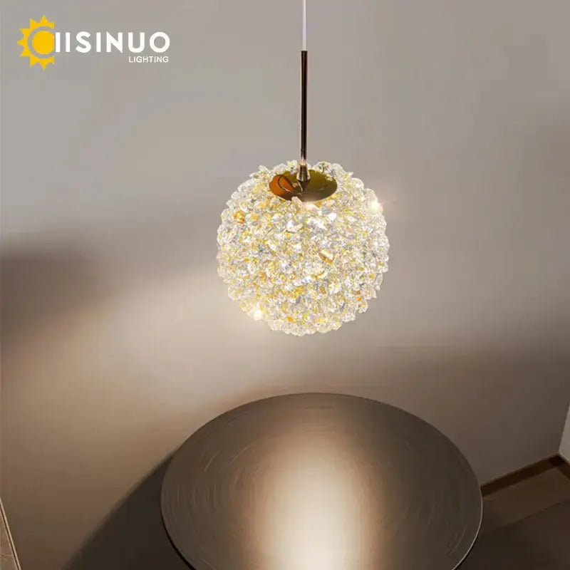 Modern gold crystal ball pendant light with gold stem and clear faceted crystals for elegant bedroom decorbites pendant light