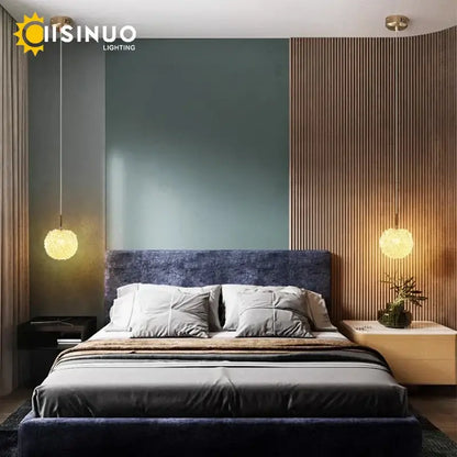 Modern gold crystal ball pendant light featuring warm amber textured glass surfaces for elegant bedroom decorbites crystal ball pendant