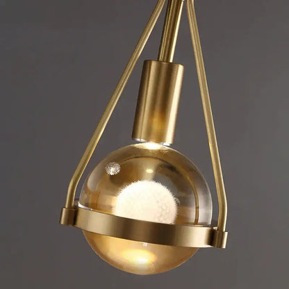 Modern gold crystal ball pendant light with brass finish and geometric frame for dining room pendant lights decorbites crystal ball
