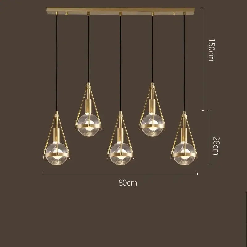 Modern gold crystal ball pendant light with five brass and glass bulbs by decorbites for dining room decor