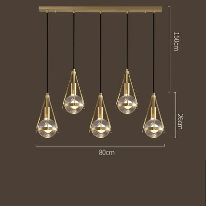 Modern gold crystal ball pendant light with five brass and glass bulbs by decorbites for dining room decor