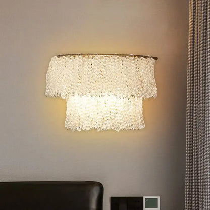 Modern gold sconce lamp featuring two tiers of clear crystal beads with fixture height for 220v-240v bedroom use