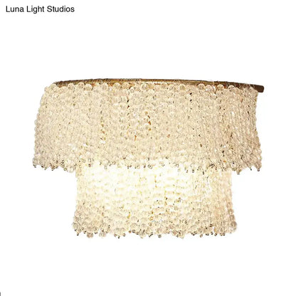 Modern gold crystal bead sconce lamp with tiered crystal chandelier and warm brass frame 220v-240v fixture height