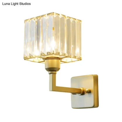Modern gold-finished crystal block wall sconce with square vertical faceted crystal shade for bedroom lighting