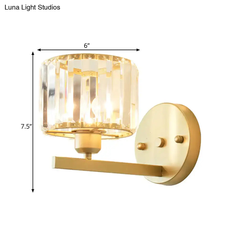 Modern gold crystal block wall sconce with cylindrical crystal shade for elegant bedroom lighting on block wall
