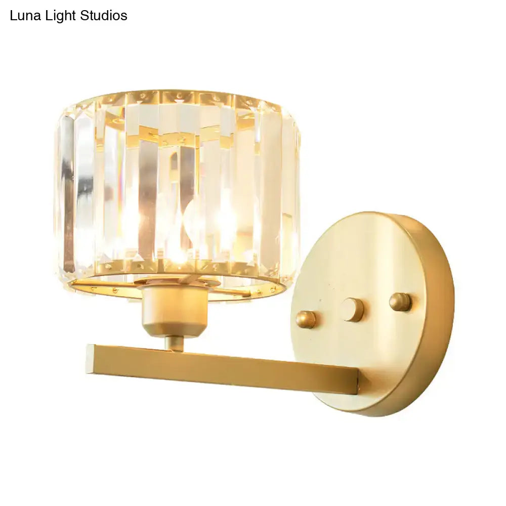 Modern gold crystal block wall sconce with faceted crystal shade for elegant bedroom lighting on block wall