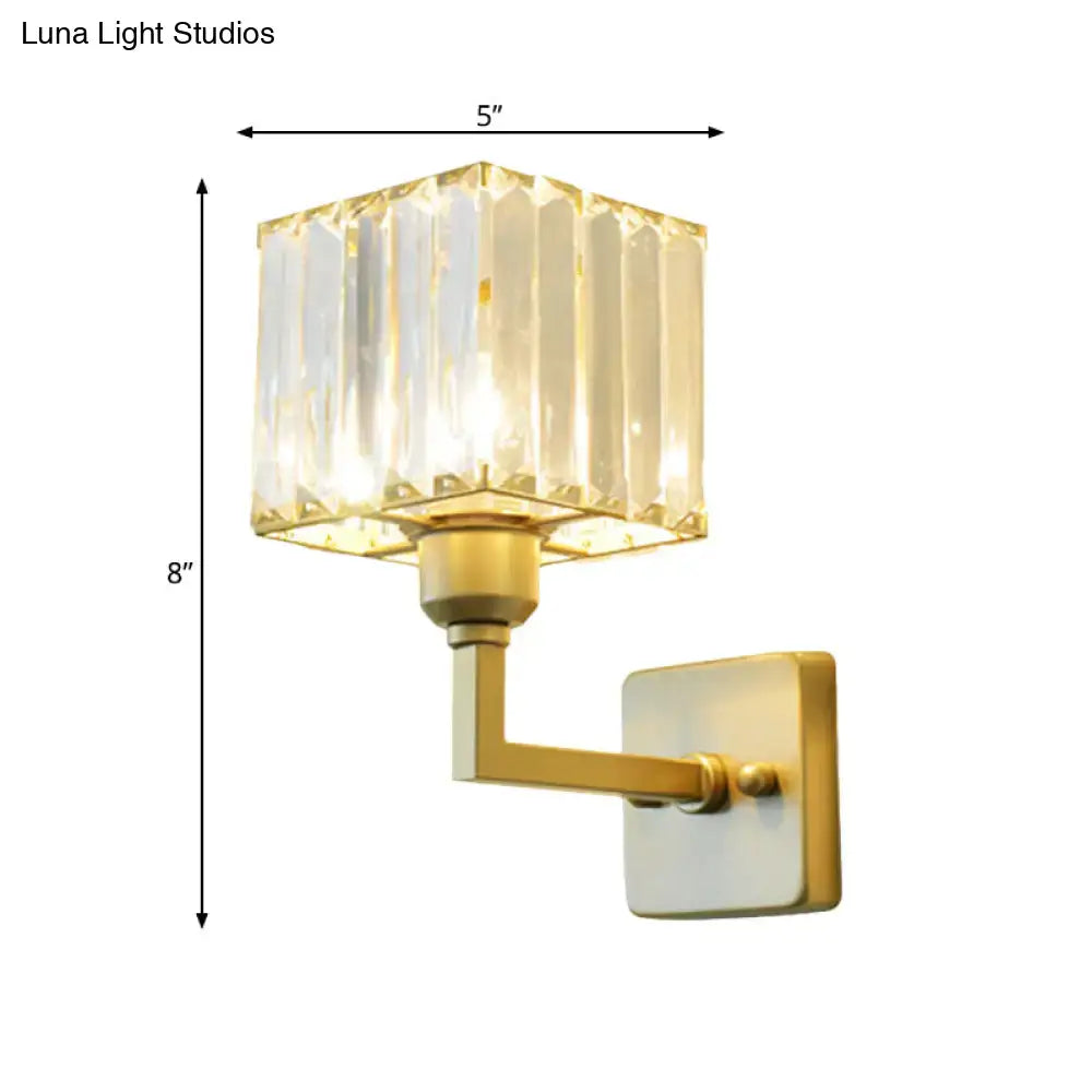 Modern gold crystal block wall sconce with faceted crystal shade ideal for bedroom lighting on block wall