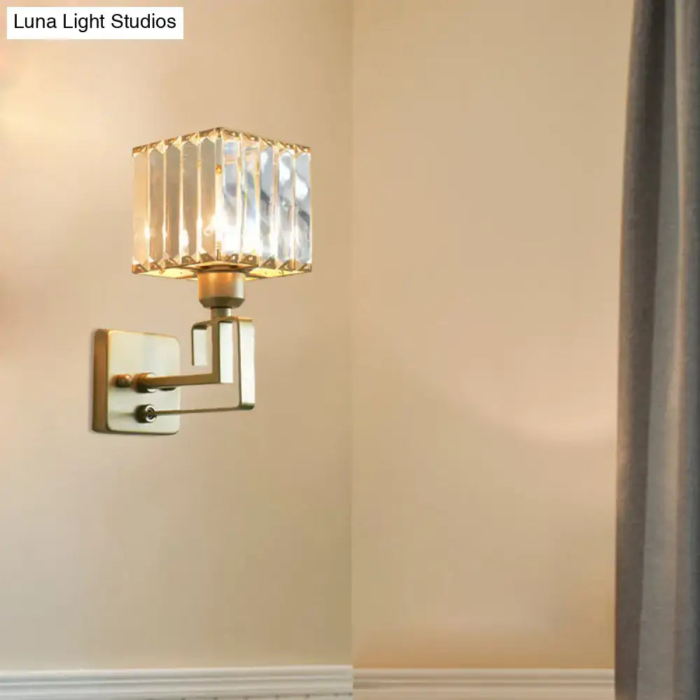 Modern gold crystal block wall sconce with square faceted crystal block shade and brushed brass arms for bedroom lighting
