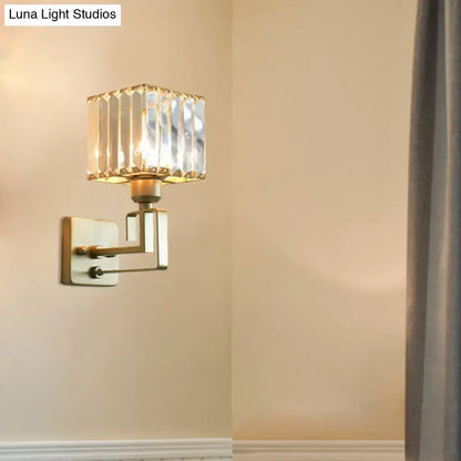 Modern gold crystal block wall sconce with square faceted crystal block shade and brushed brass arms for bedroom lighting