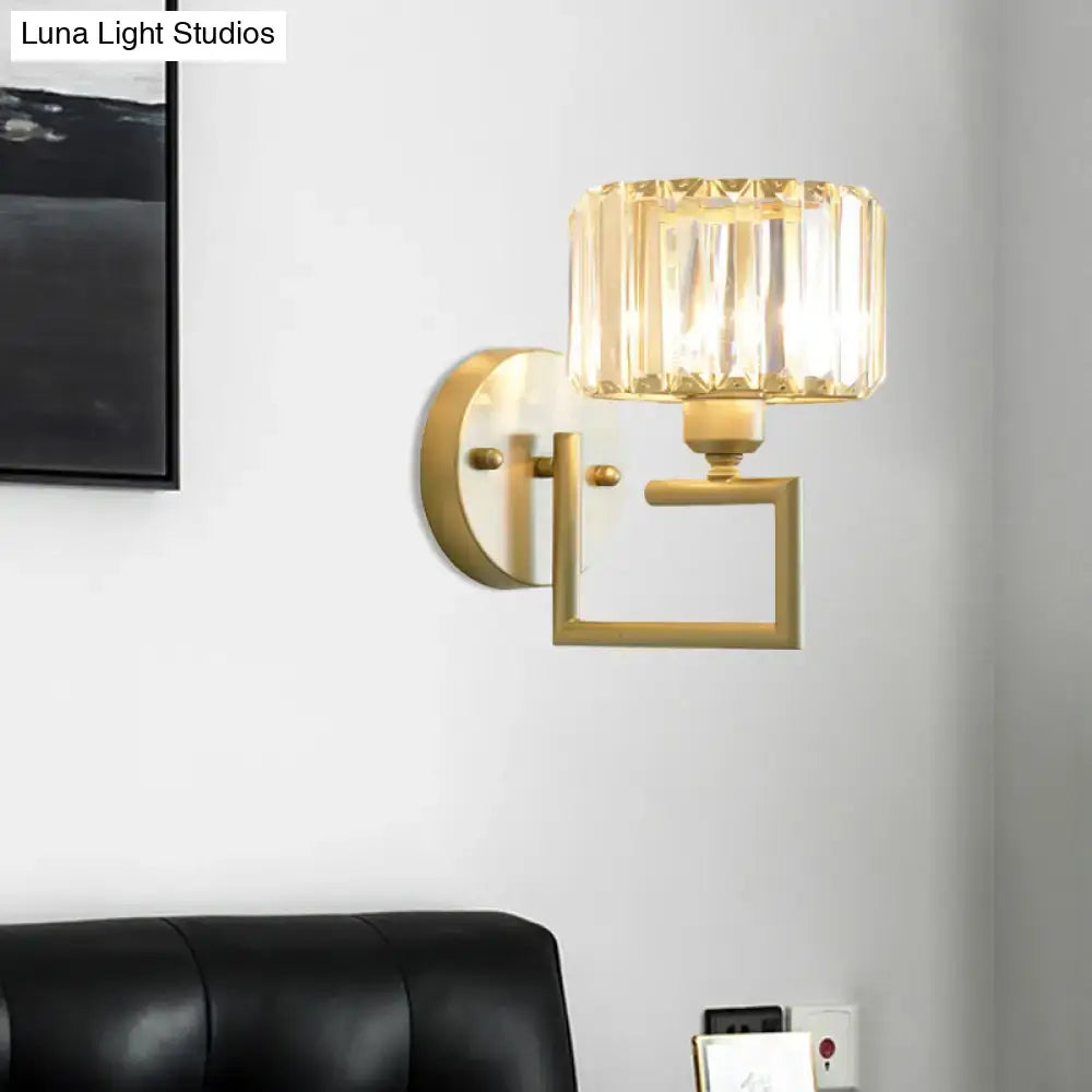 Modern gold crystal block wall sconce with faceted crystal block shade for bedroom lighting on block wall
