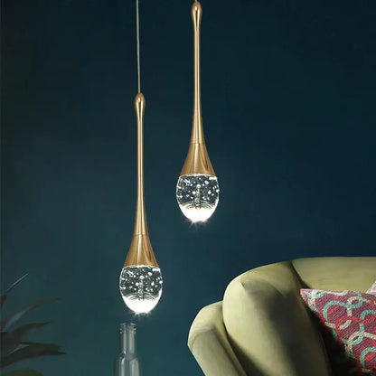 Two elegant gold-toned decorbites crystal bubble pendant lights with teardrop crystal globes for modern dining room decor