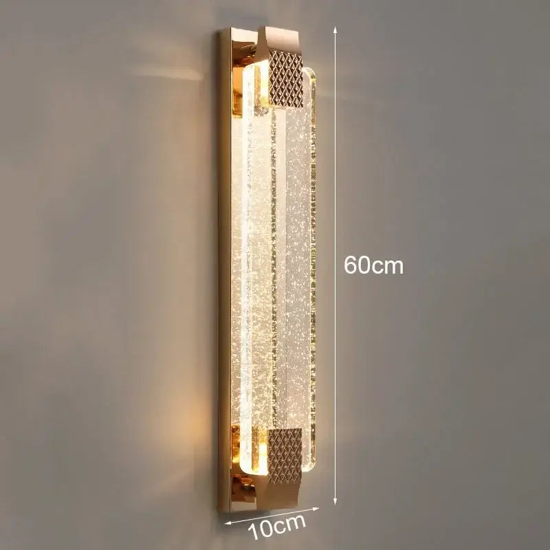 Modern gold crystal bubble wall light featuring a rectangular textured crystal panel and illuminated glass body decorbites wall lights