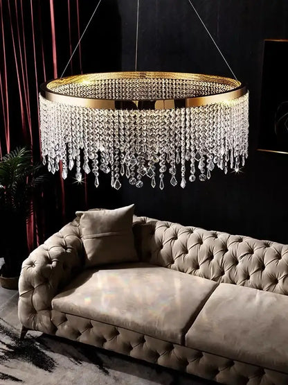Modern gold crystal chandelier lighting fixture with cascading clear crystal droplets for elegant dining room decorbites decor