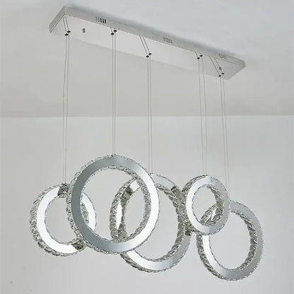 Modern chrome-finished pendant chandelier with interlocking crystal rings for elegant dining room decorbites crystal circle led lighting