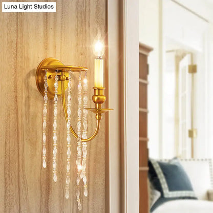Modern gold-toned wall lamp with dangling crystal beads and candle-style bulb ideal as lights corridor wall or bedroom lamp