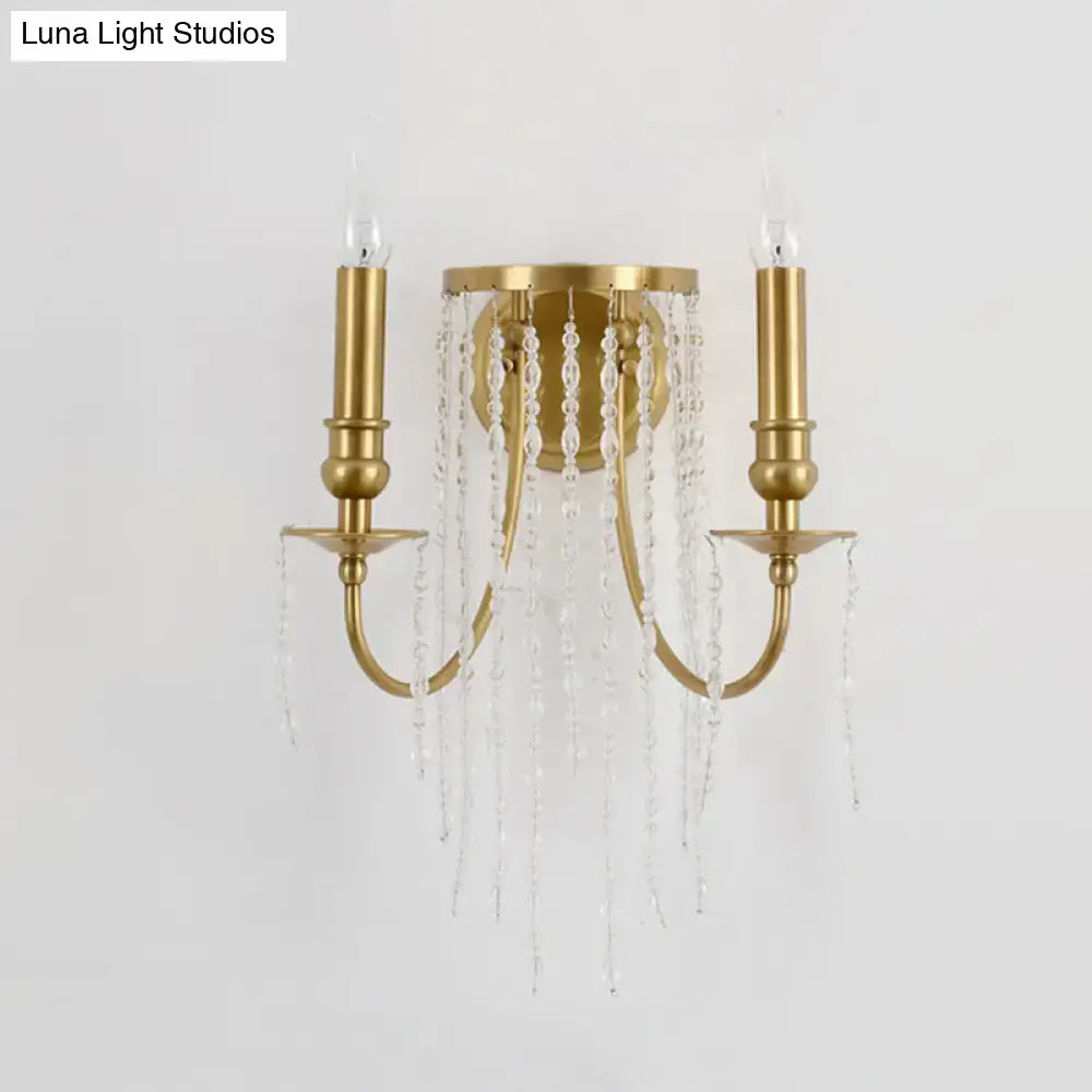 Modern gold crystal corridor wall lamp with two candle-style arms and cascading clear crystal beads for bedroom lighting