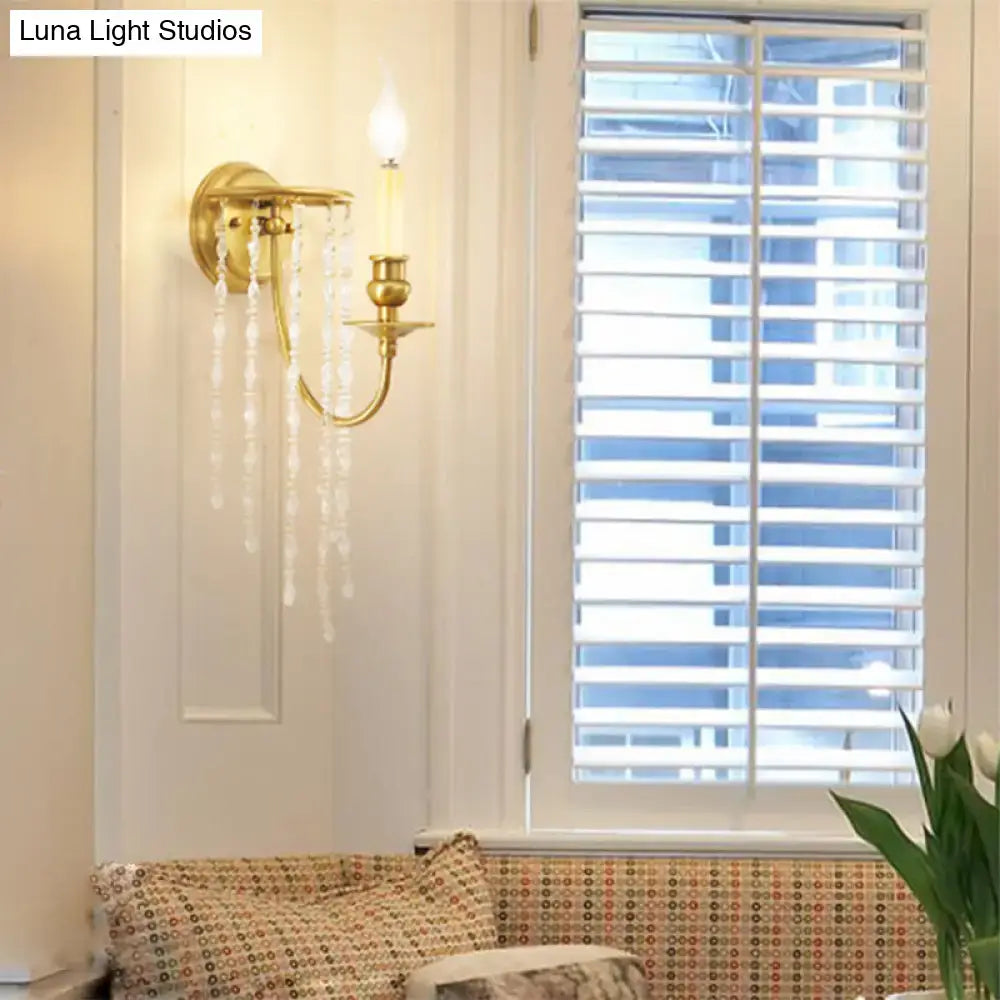 Modern gold corridor wall lamp with crystal droplets designed as an elegant wall sconce for bedroom lighting