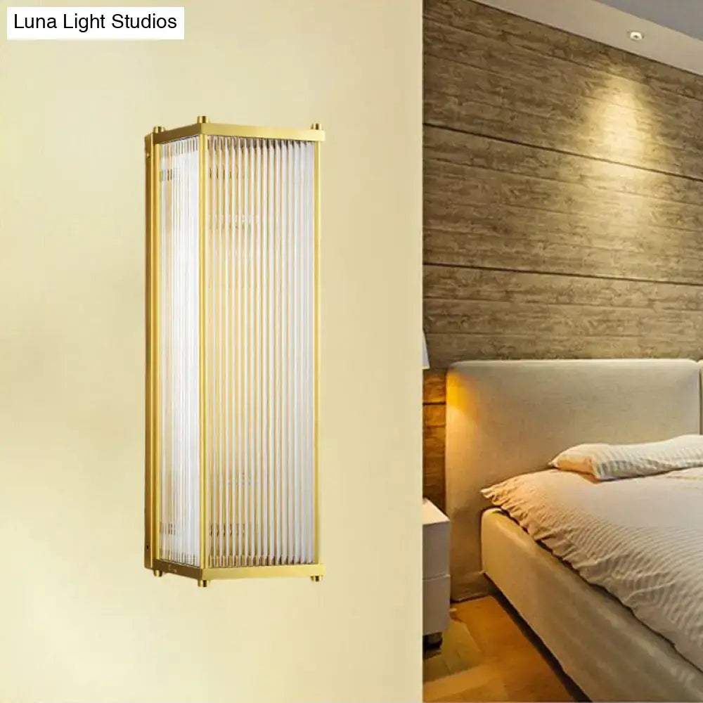 Modern gold wall sconce light with direct wired electric and frosted glass panels for bedroom use