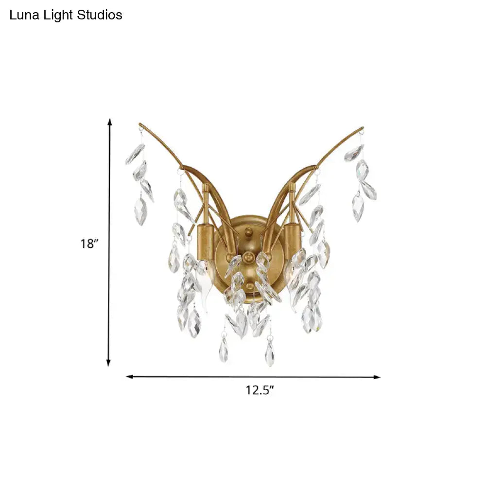 Modern gold crystal drop wall sconce with elegant curved arms and cascading clear crystal droplets for living room lighting