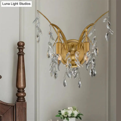 Modern gold crystal drop wall sconce with elegant branching arms and clear crystal droplets for living room lighting