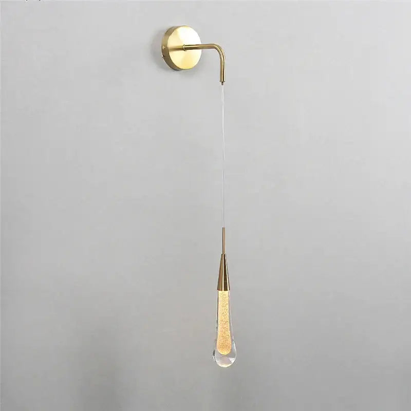Modern gold crystal droplet wall lamp with a teardrop glass pendant filled with glowing golden beads for living room decorbites crystal droplet wall sconce