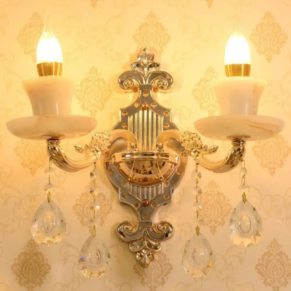 Modern gold crystal droplet wall mount light featuring ornate gold-toned design with marble-like shades and crystal pendants