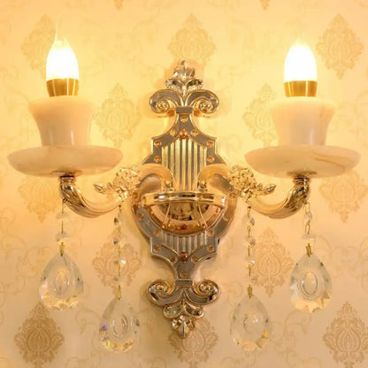 Modern gold crystal droplet wall mount light featuring ornate gold-toned design with marble-like shades and crystal pendants