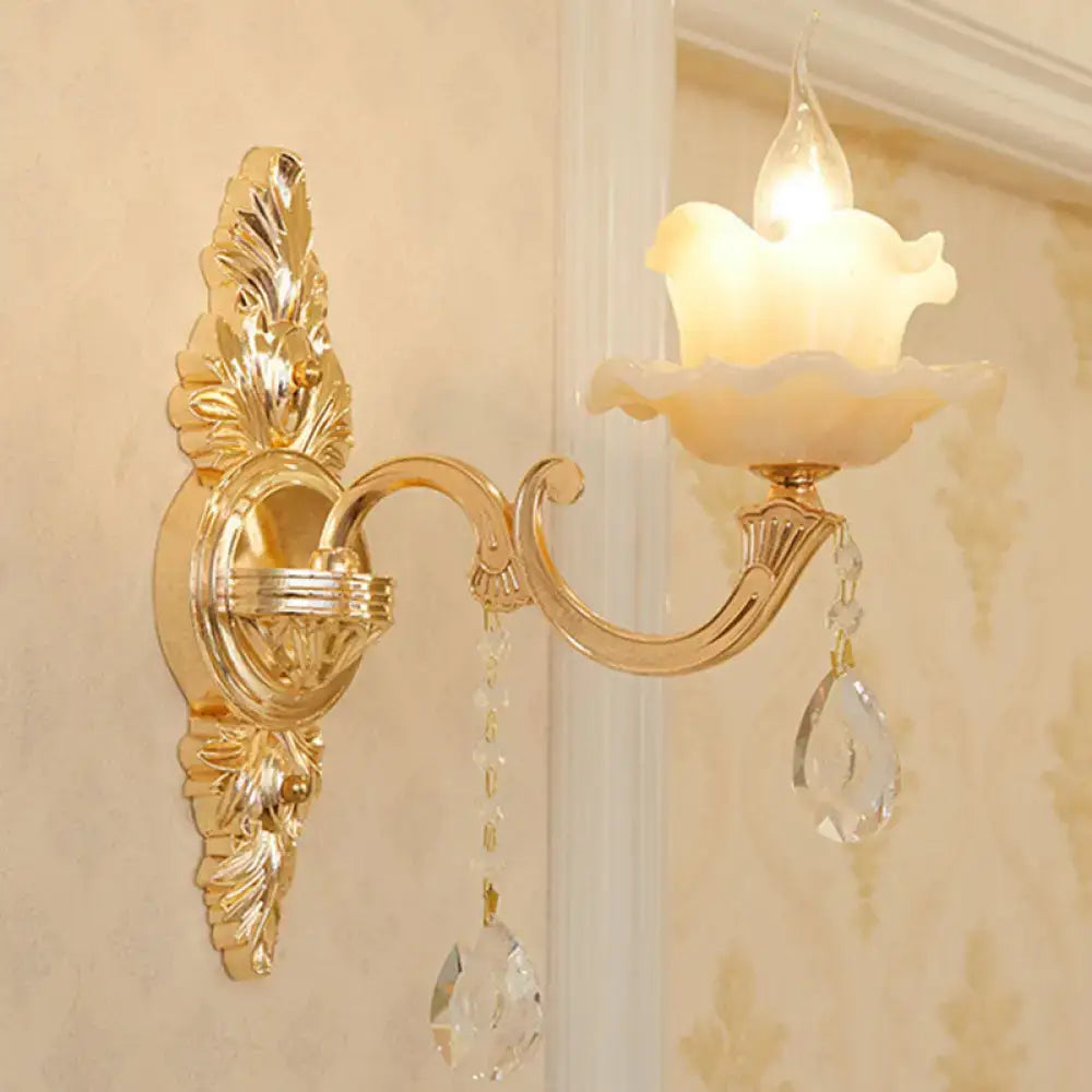 Modern gold crystal droplet wall mount light featuring ornate gold-toned metal and frosted glass shade with crystal accents