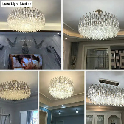 A modern DecorBites™ minimalist crystal drum pendant light with clear teardrop crystals for living room use
