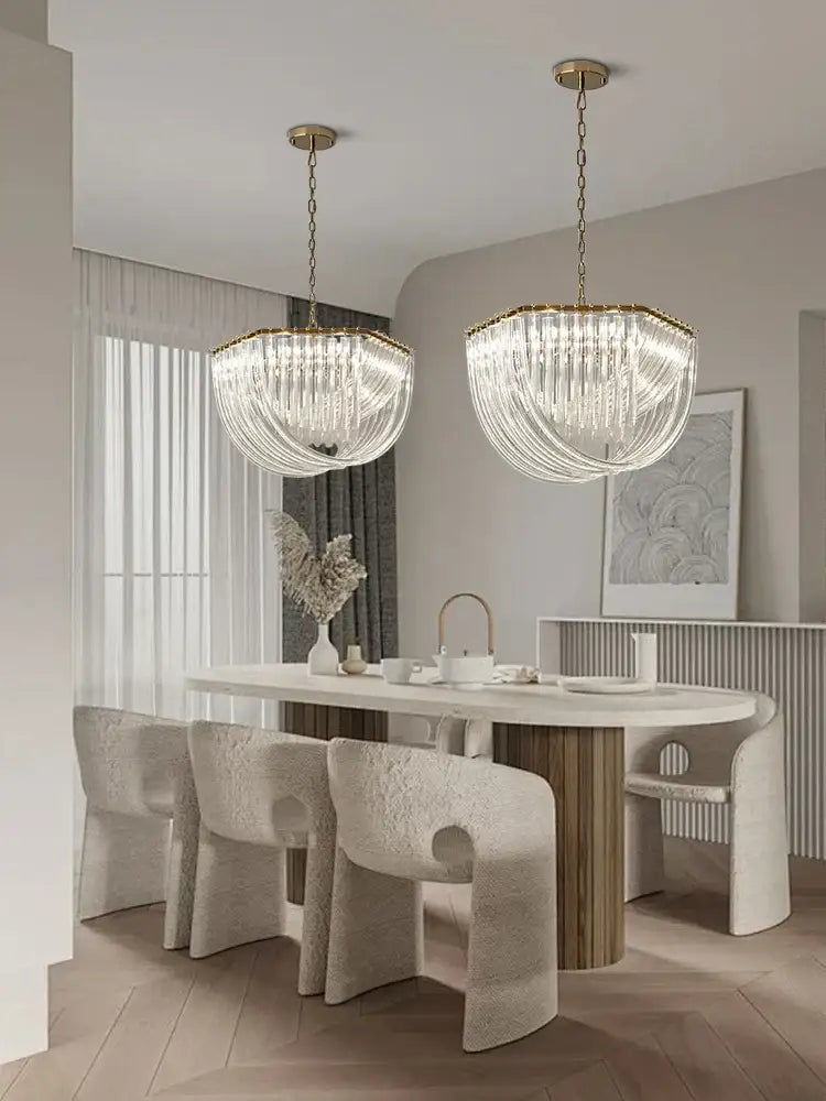 Two elegant gold crystal glass pendant lights with cascading strands for modern dining room decorbites chandelier