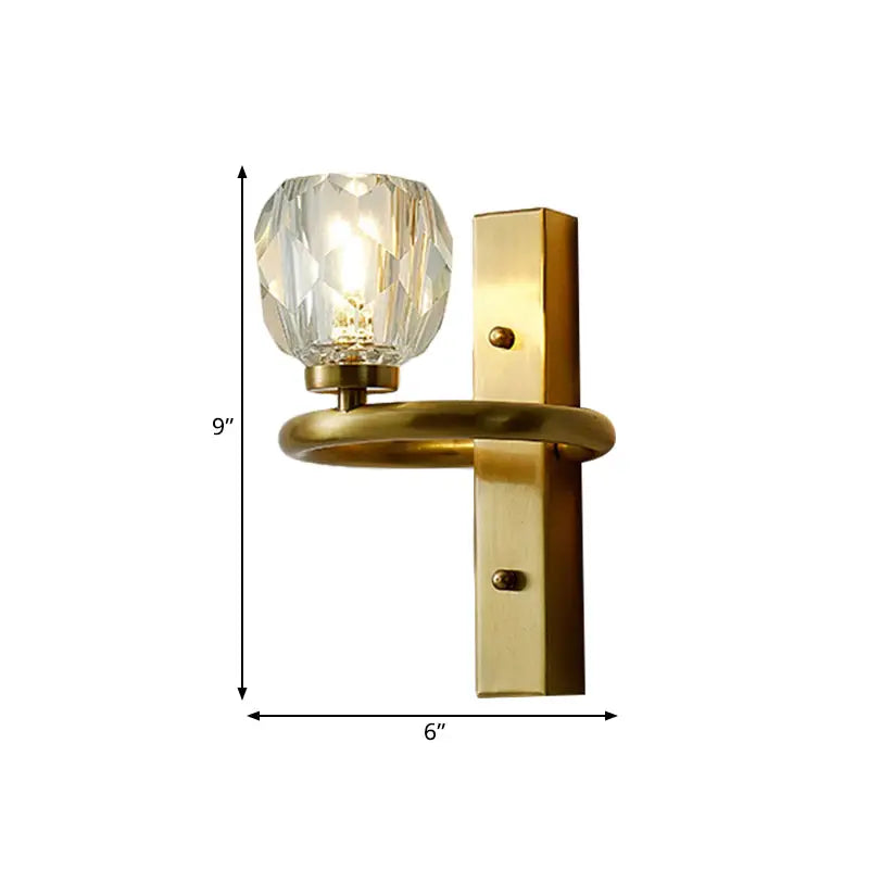 Gold-toned modern crystal globe wall lamp with faceted globe and rectangular backplate for 110v-120v use