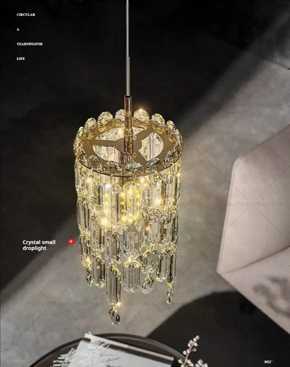 Modern gold crystal headboard chandelier with cascading faceted glass prisms and warm led lighting decorbites crystal headboard