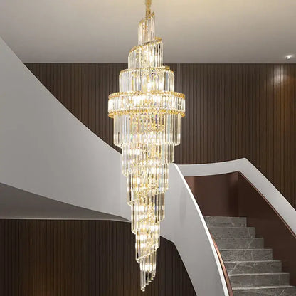 Modern gold crystal hollow chandelier with cascading light and gold accents elegantly hangs above staircase decorbites crystal hollow