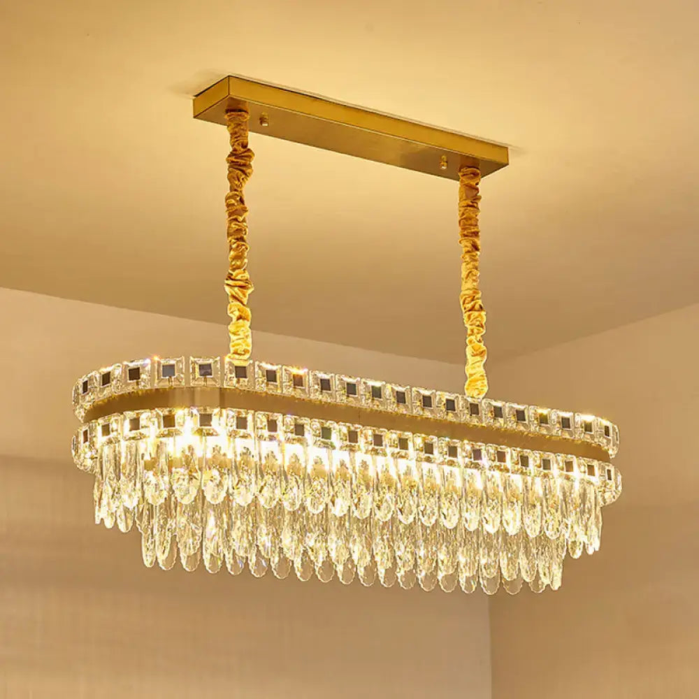 Gold-toned rectangular decorbites contemporary island light with cascading crystal droplets suitable for 110v-120v and 220v-240v