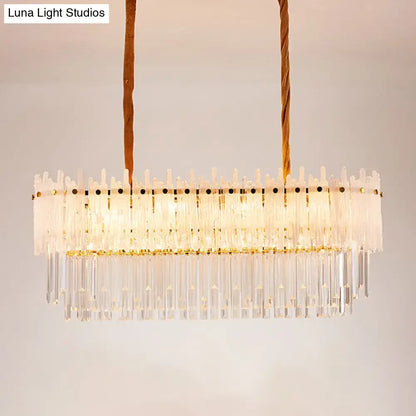 A modern decorbites minimalist 9-light crystal chandelier with clear glass rods and frosted accents for dining room island lighting