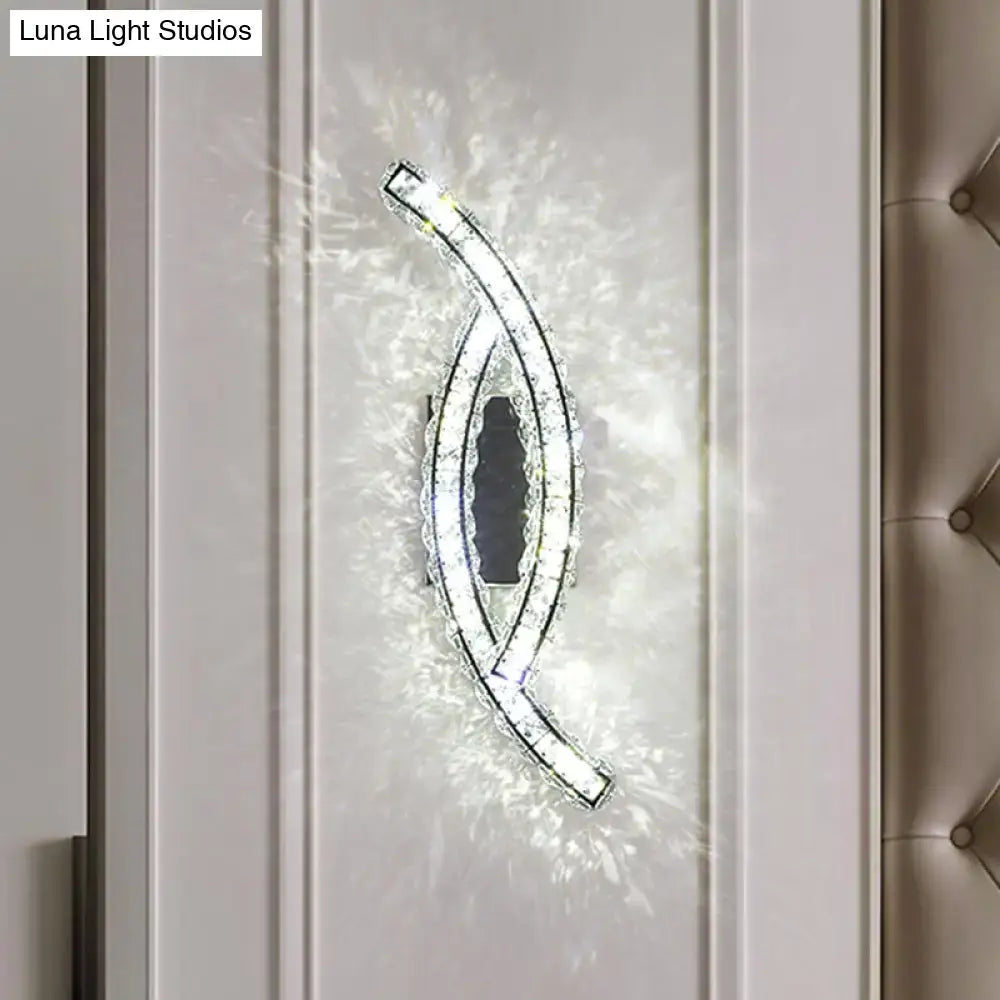 A sleek modern gold crystal leaf wall light with curved design and embedded LED for crystal living room use