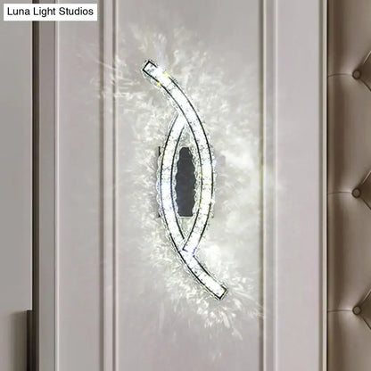 A sleek modern gold crystal leaf wall light with curved design and embedded LED for crystal living room use
