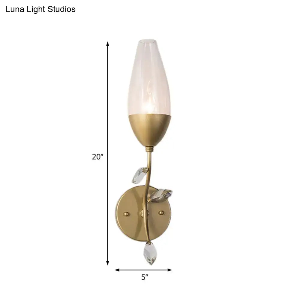 Modern gold crystal leaf wall sconce with frosted glass shade and crystal leaf design in a gold finish for bedroom lighting